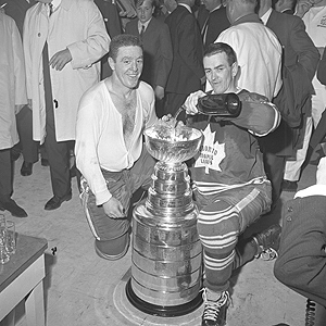 Dave Keon and Marcel Pronovost preparing to drink from the cup